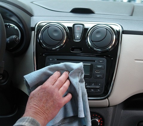 cleaning the car interior with a cloth