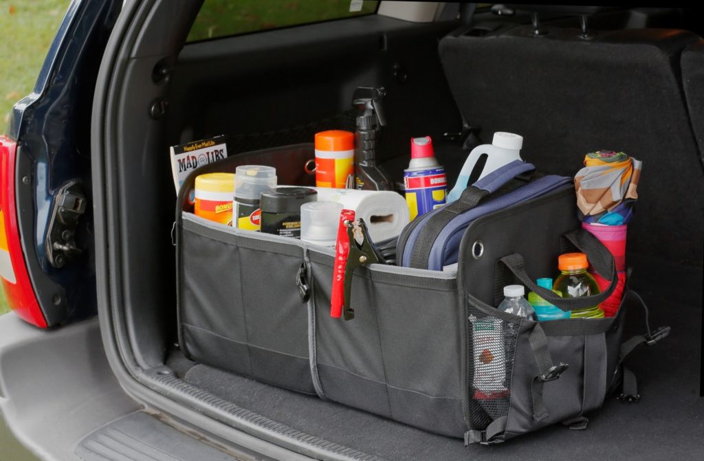 car trunk organizer sitting in an SUV holding tools and auto supplies
