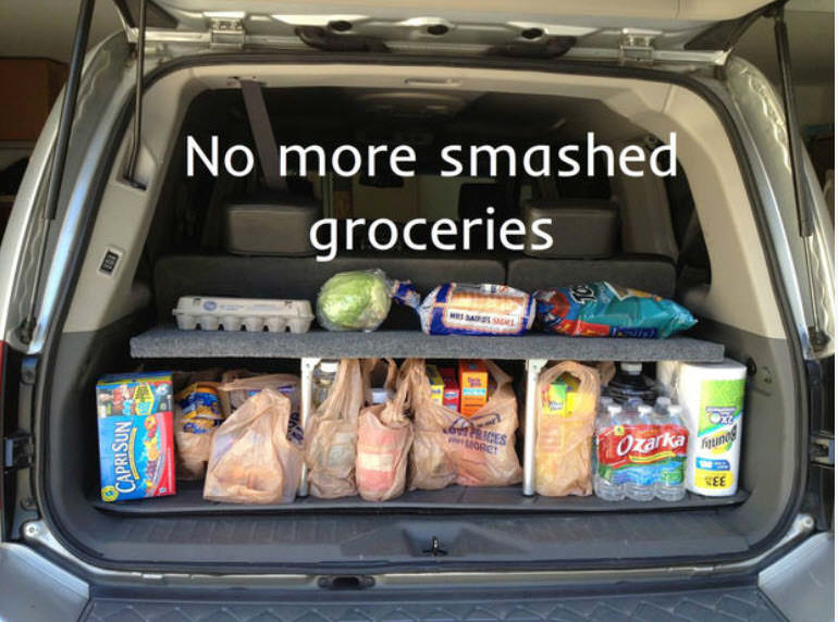 home-made pop up shelf car organizer with groceries in back of car